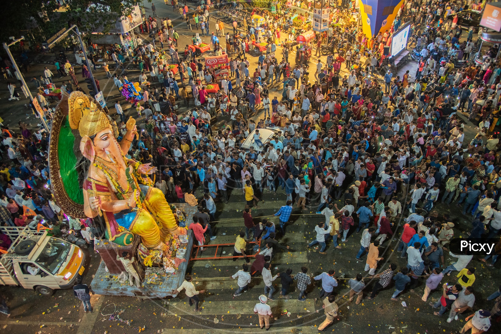 Crowd gathering near a Big ganesh Idol at Lumbini Circle under telugu thalli flyover