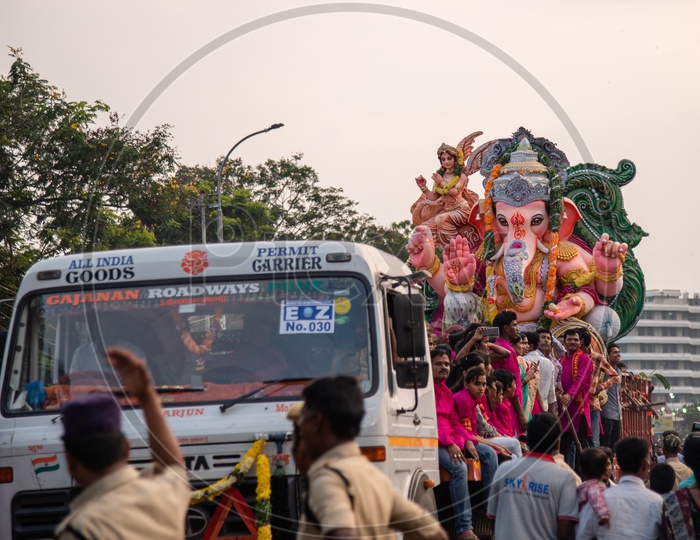 Hyderabad Police signalling a Ganesh Idol Carrying vehicle to march forward