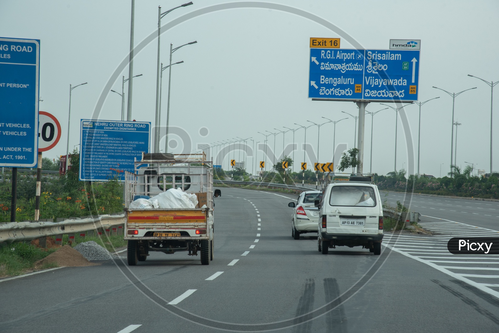 Image of Distance and exit Sign boards on Nehru Outer Ring Road,  Hyderabad-XM822744-Picxy
