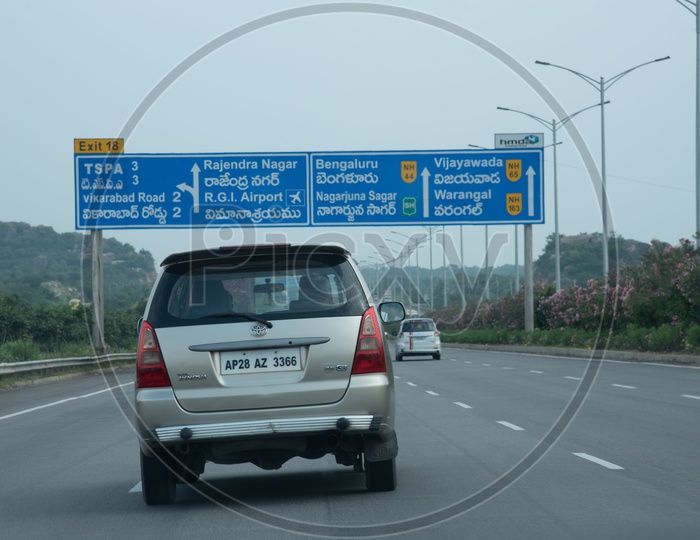 Distance and exit Sign boards on Nehru Outer Ring Road, Hyderabad