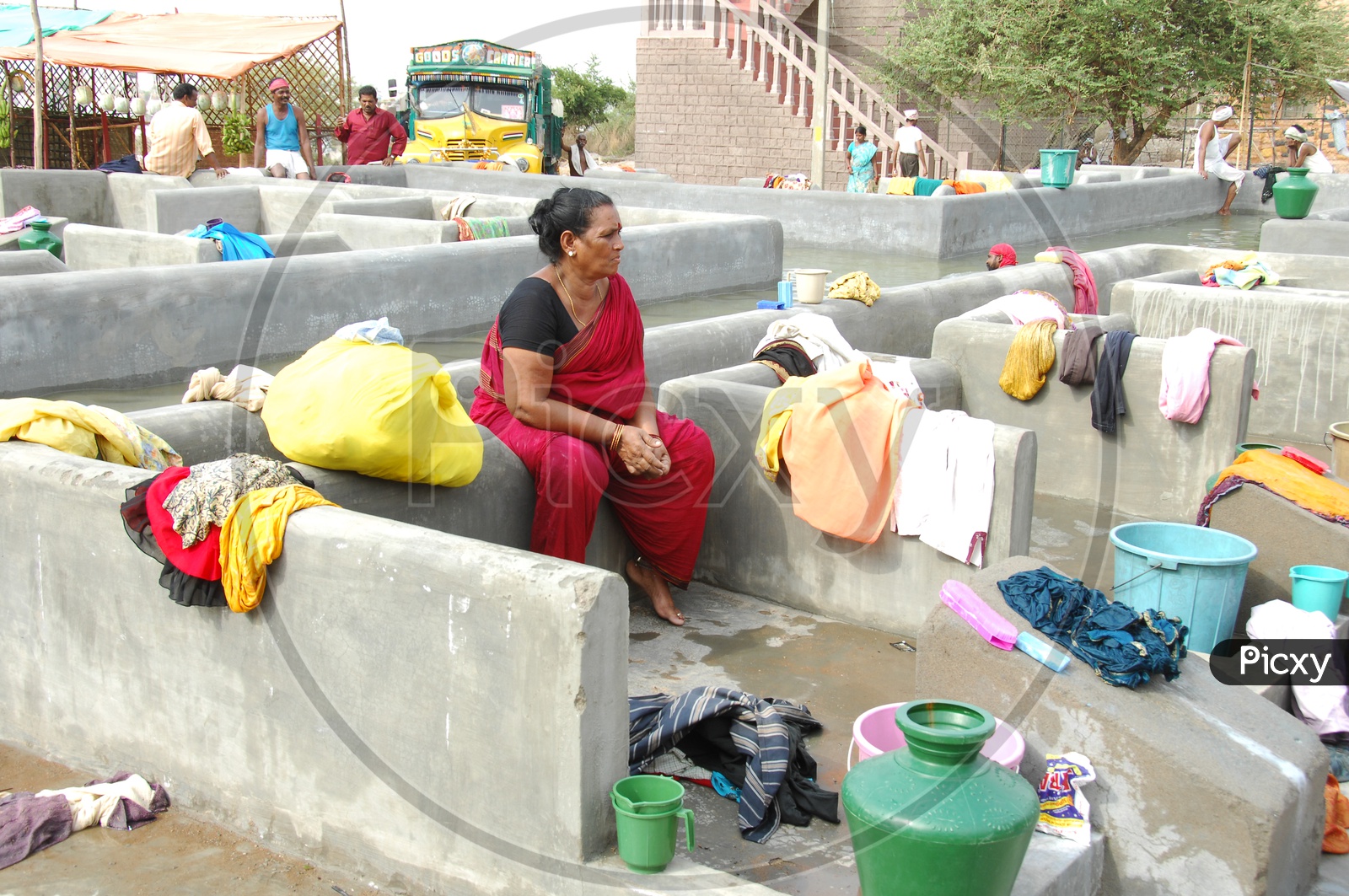 Woman washing clothes at a Dhobi Ghat