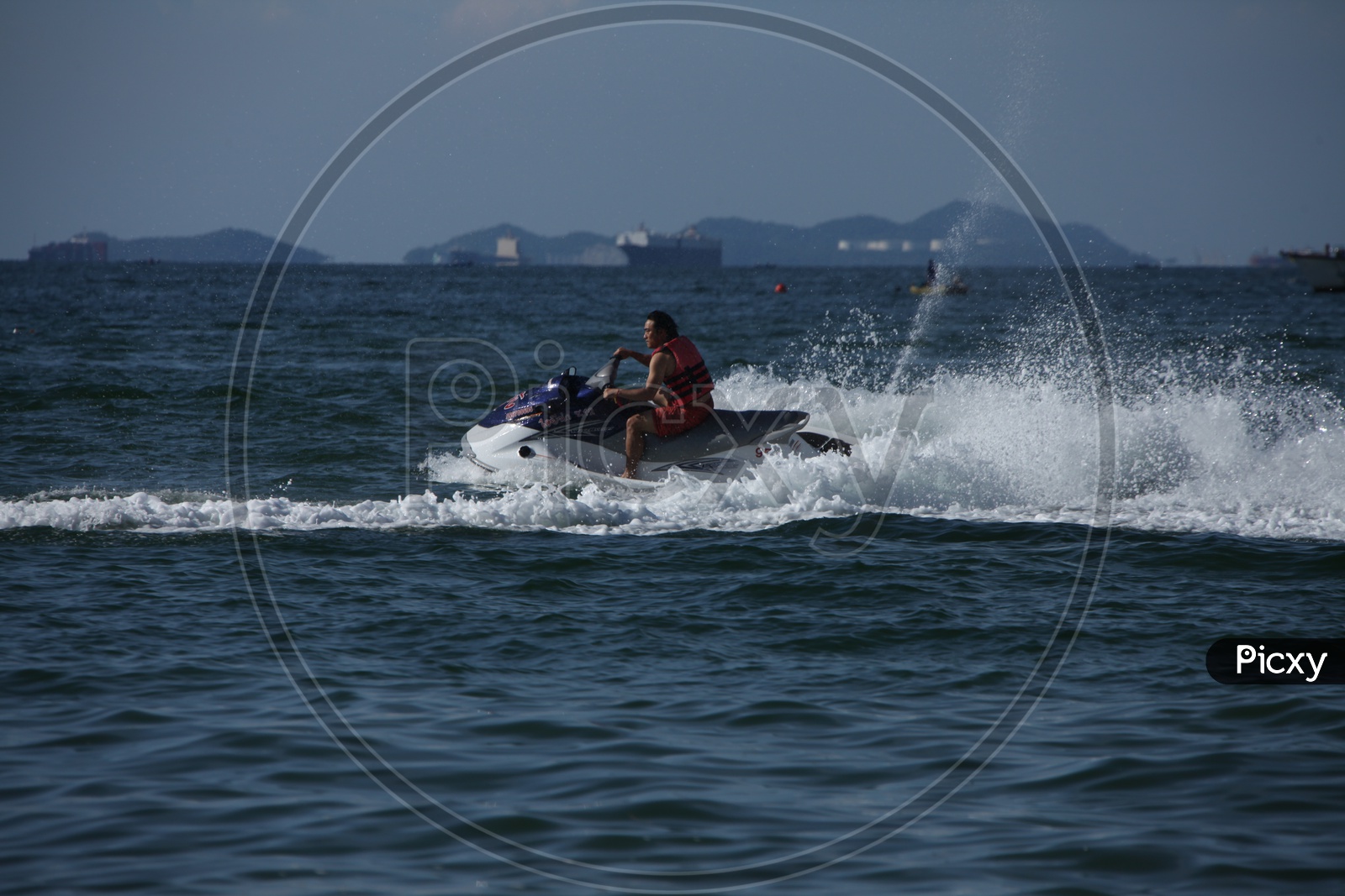 A man surfing with a Speed Boat on the Sea