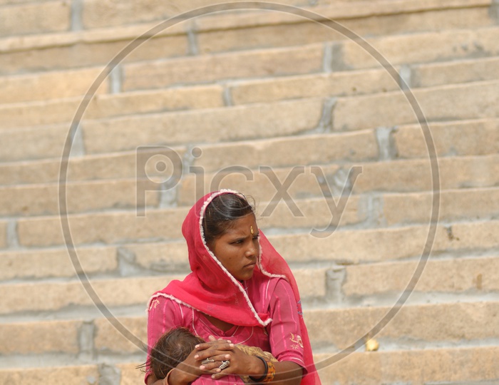 Indian Rajasthani  Mother Feeding her Child