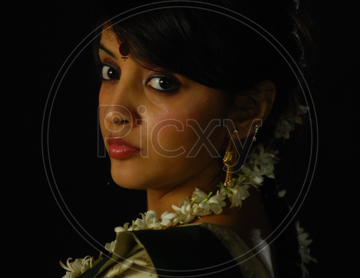 Closeup Shots Of an Indian Beautiful Women Wearing Jewellery and  Jasmine Flowers in Hair