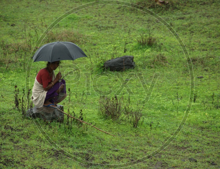 South indian Rural woman with umbrella