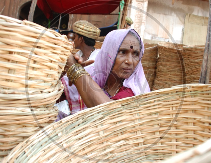Woman selling bambo baskets