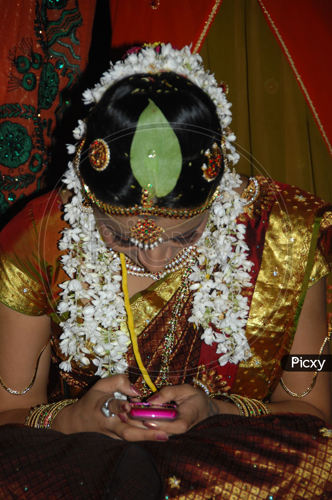 Indian Hindu Bride Using Her Mobile At Marriage