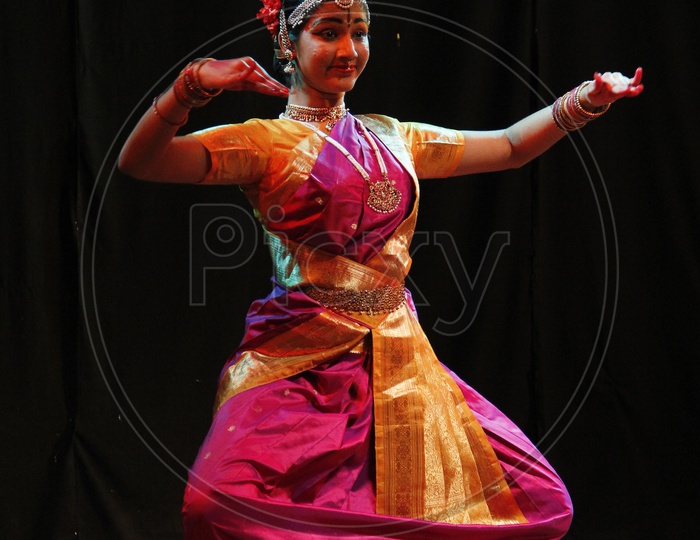 A Bharatanatyam dancer poses in a posture representing the Hindu god Lord  Krishna Stock Photo - Alamy