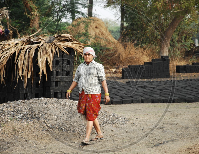 A woman working in a Brick Kiln