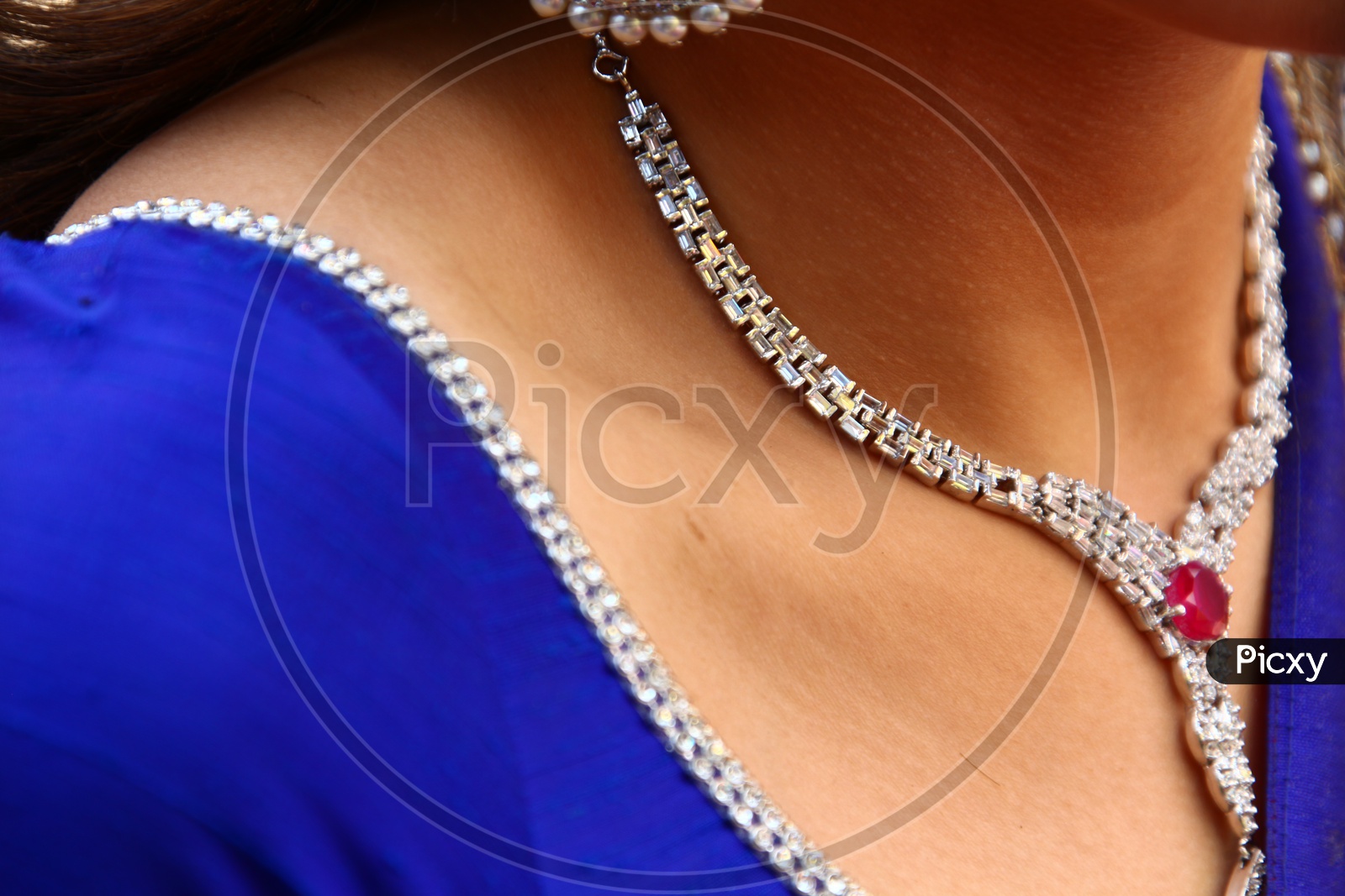 A Female Model Wearing A Necklace Closeup Shot