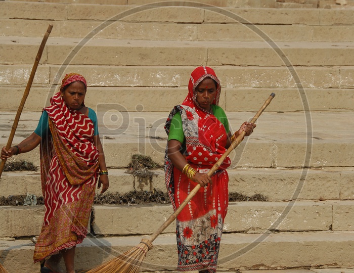 women cleaning the streets of Varanasi