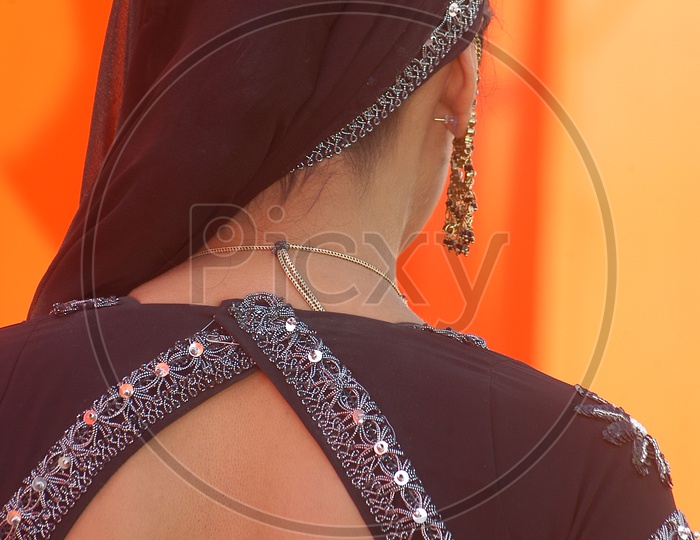 Rear view of Indian Female Model in Rajasthani attire