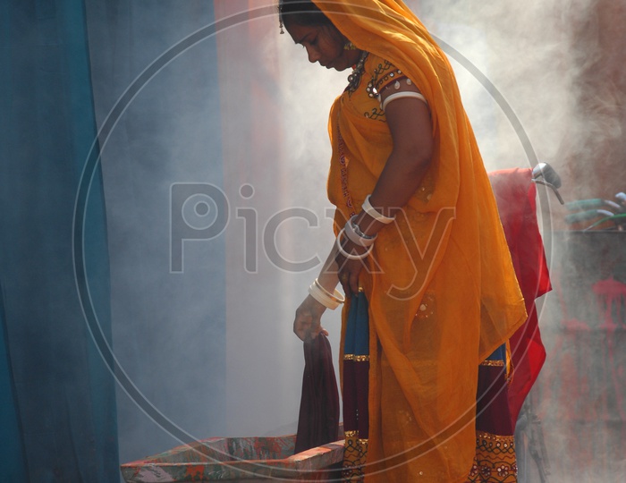 Rajasthani woman washing clothes
