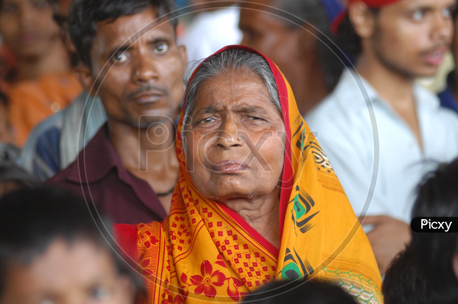 Indian Old Woman In a Crowd