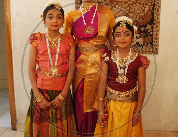 Indian Girls In a Traditional Attire For Performing Classical Dance