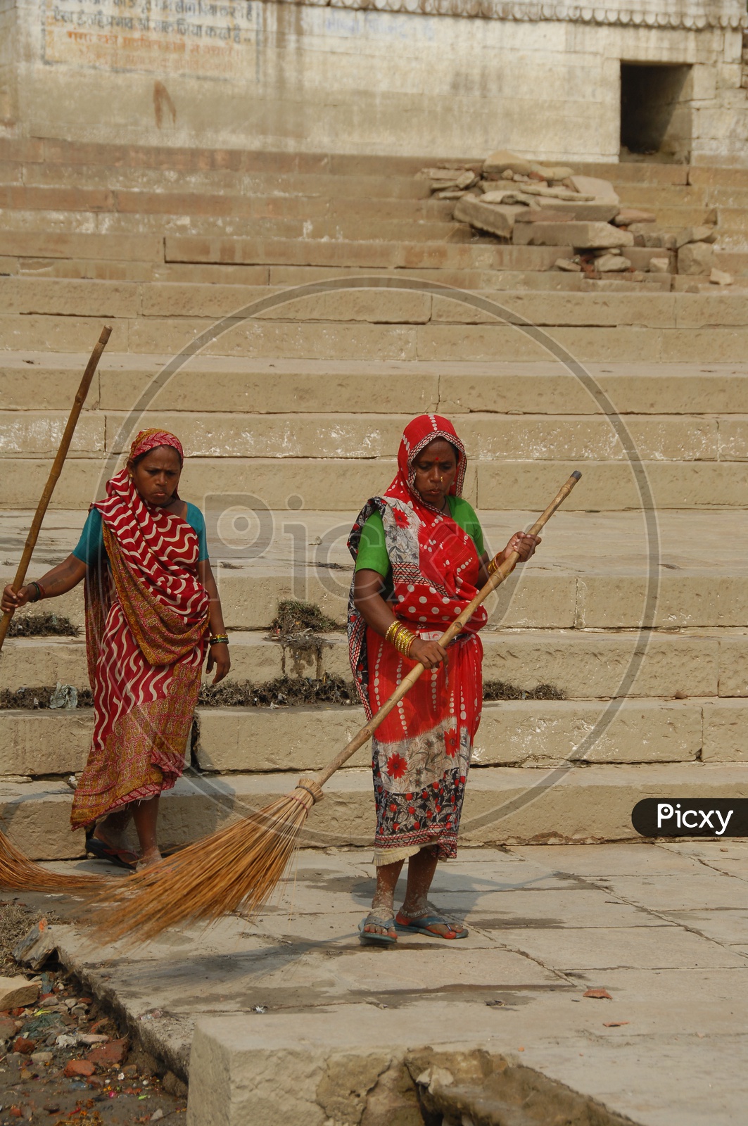 women cleaning the streets of Varanasi