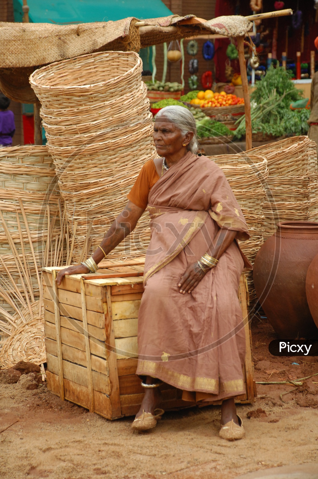 Woman selling bambo baskets