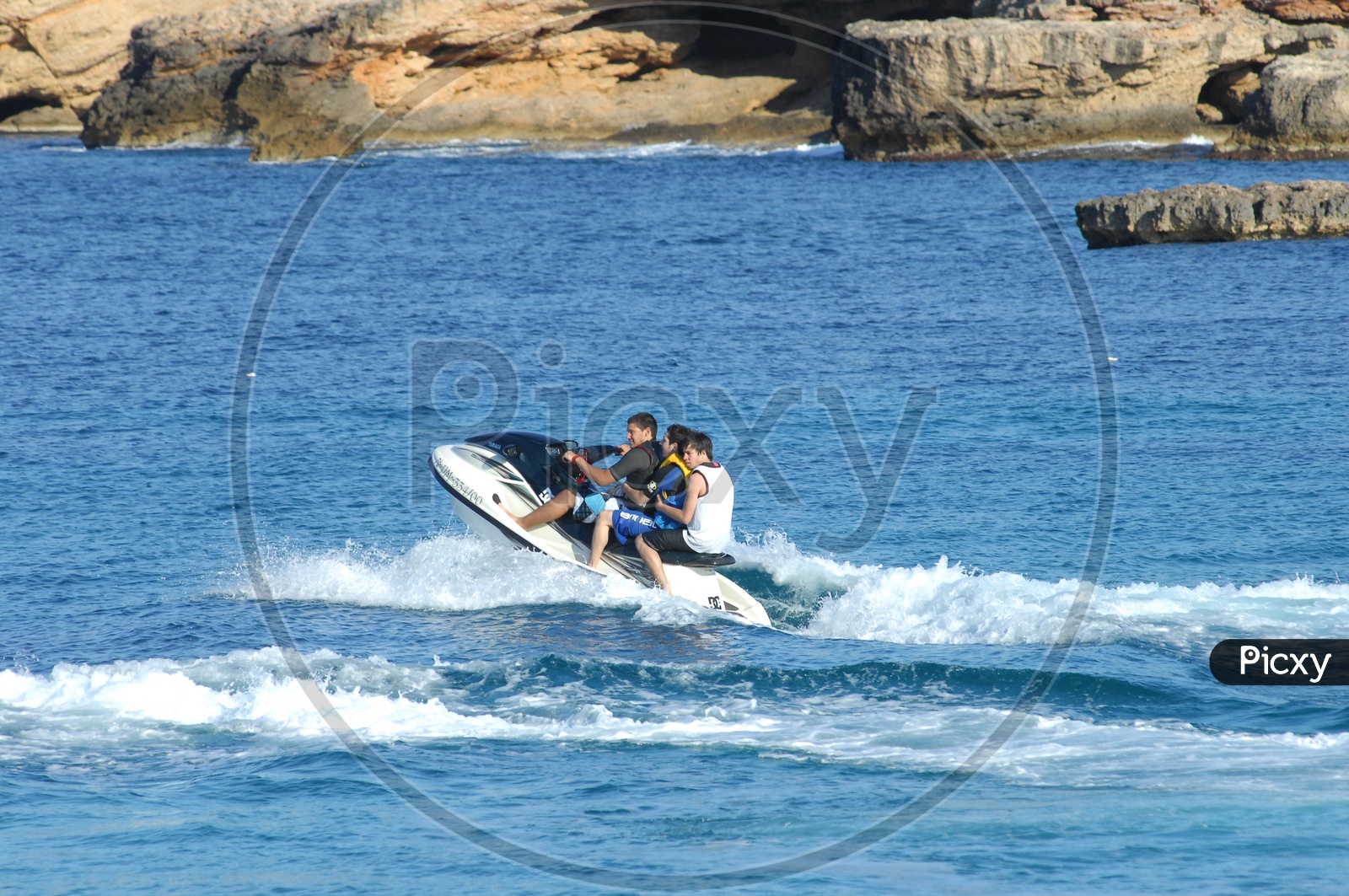 Foreign Men surfing on a Speed boat