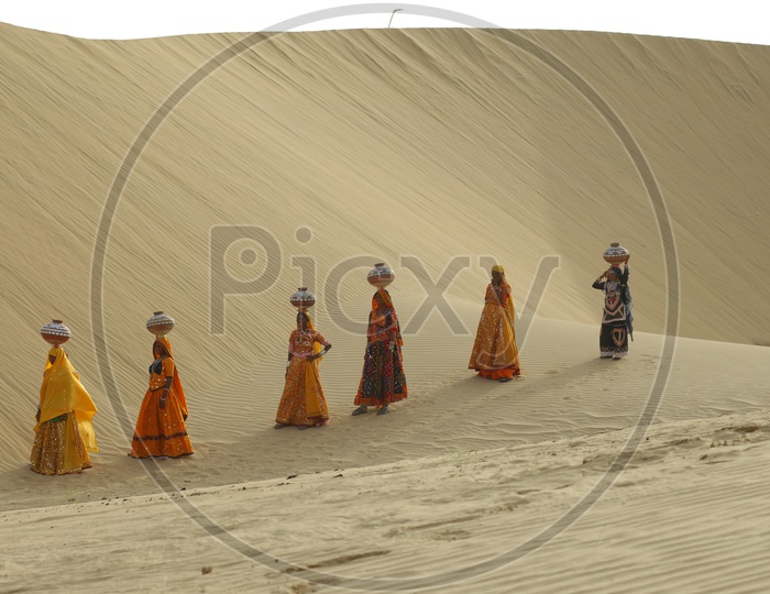 Indian Female with Pots in desert Rajasthan