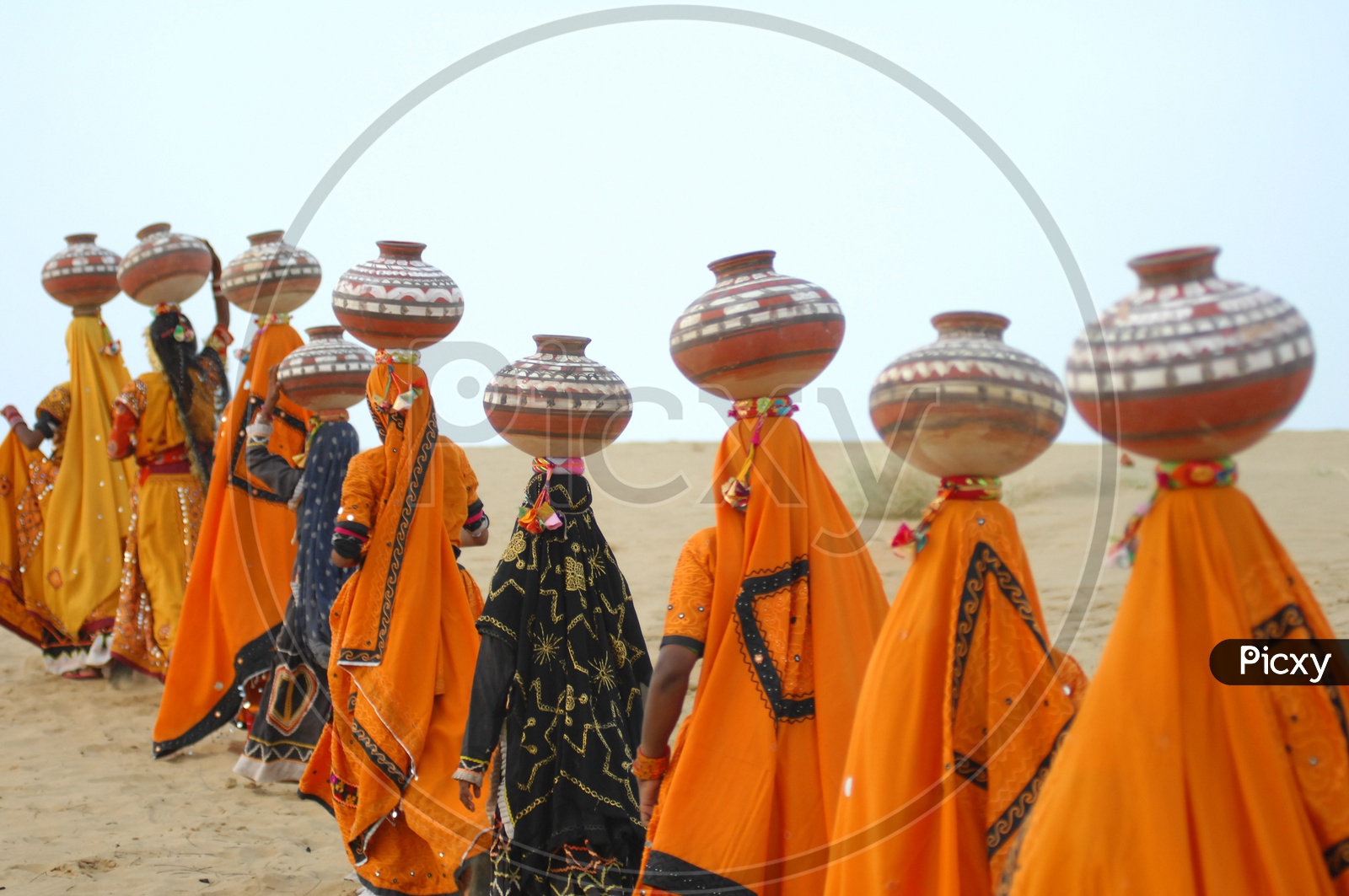 Rajasthani women carrying pots on their heads