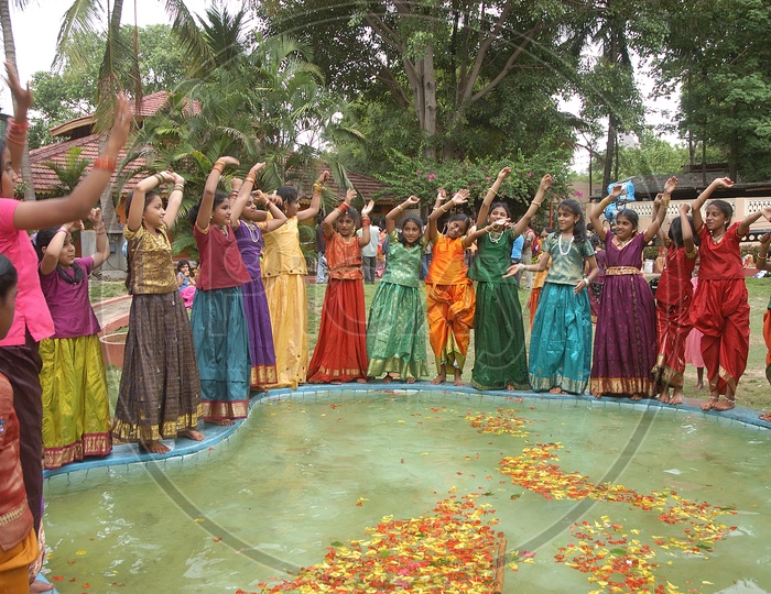 Indian Girl Children In Traditional Dresses Performing a Group Dance
