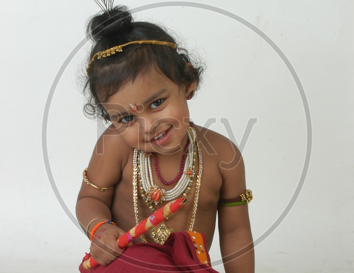 A Cute Indian Boy in a Hindu God Sri Krishna Getup
