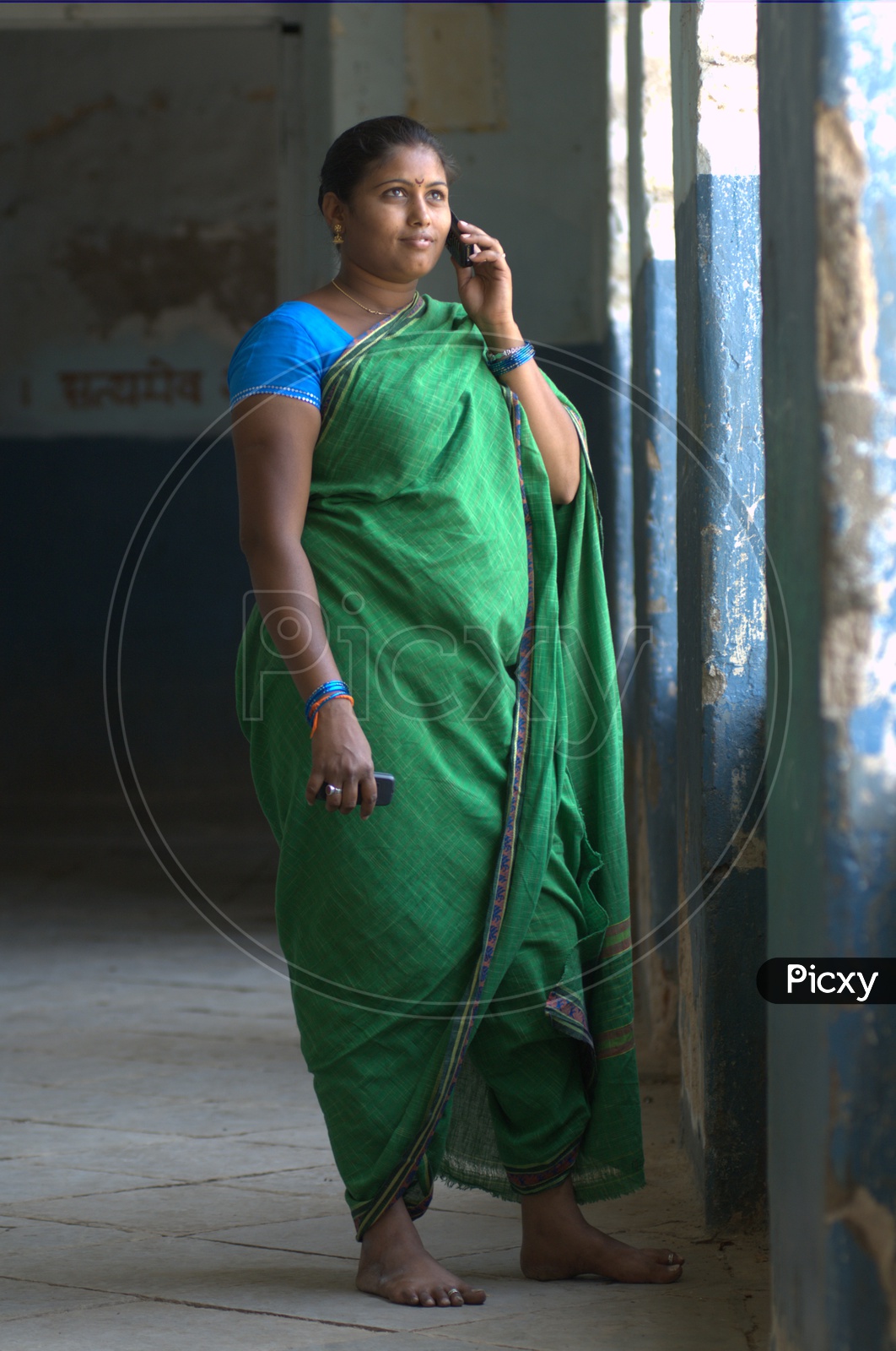 Indian Rural Woman Speaking In Mobile Phone