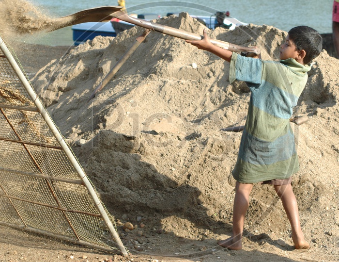 Indian boy Child Working in a Construction Site / Child Labour