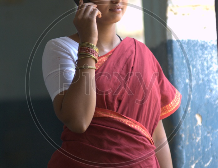 Indian Rural Woman Speaking In CellPhone