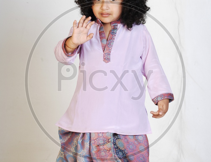 Indian Boy in Traditional Attire Over an Isolated White Background