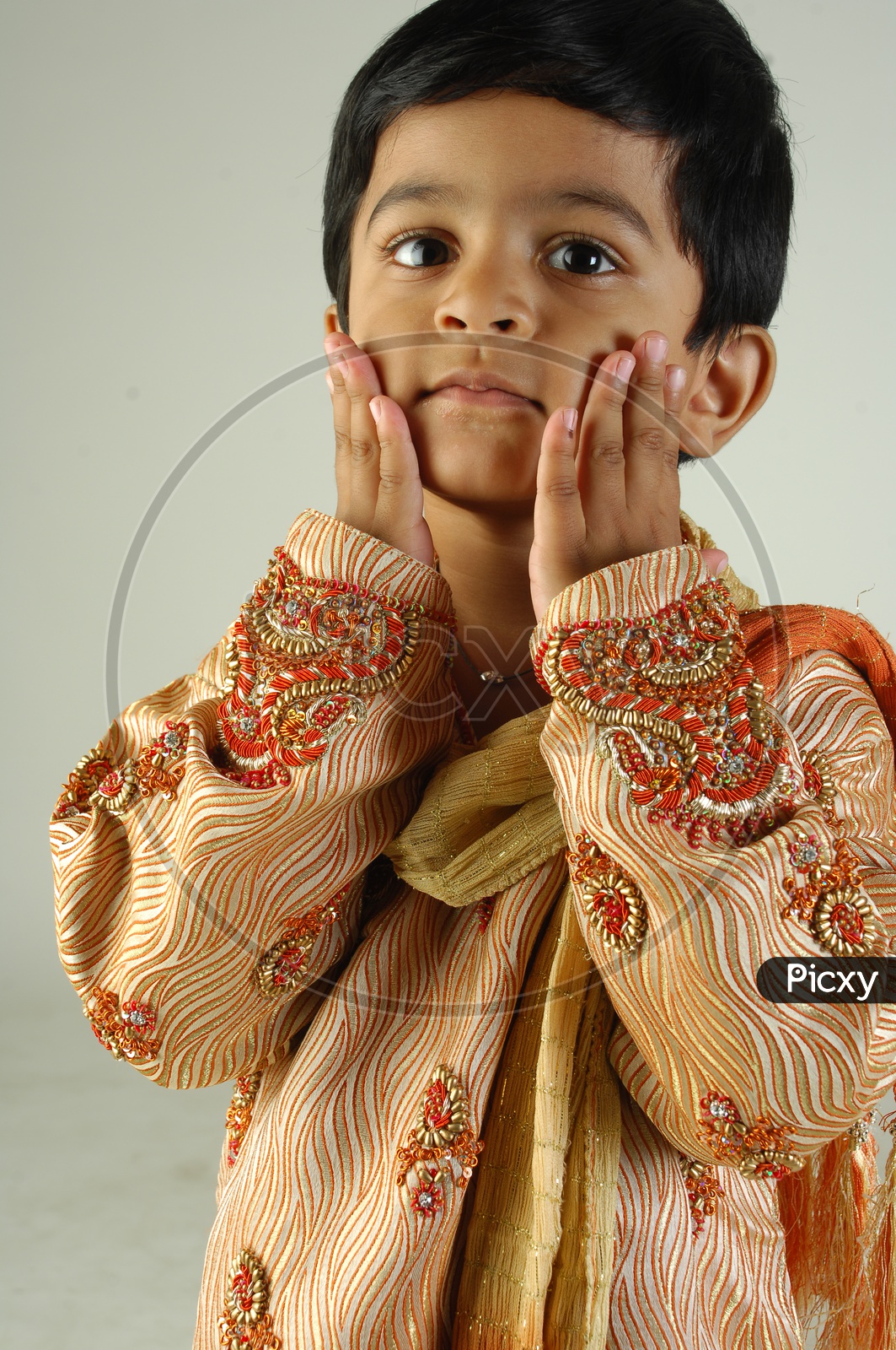 Indian Boy in Traditional Clothes With a Smiling Face   Over an Isolated White Background