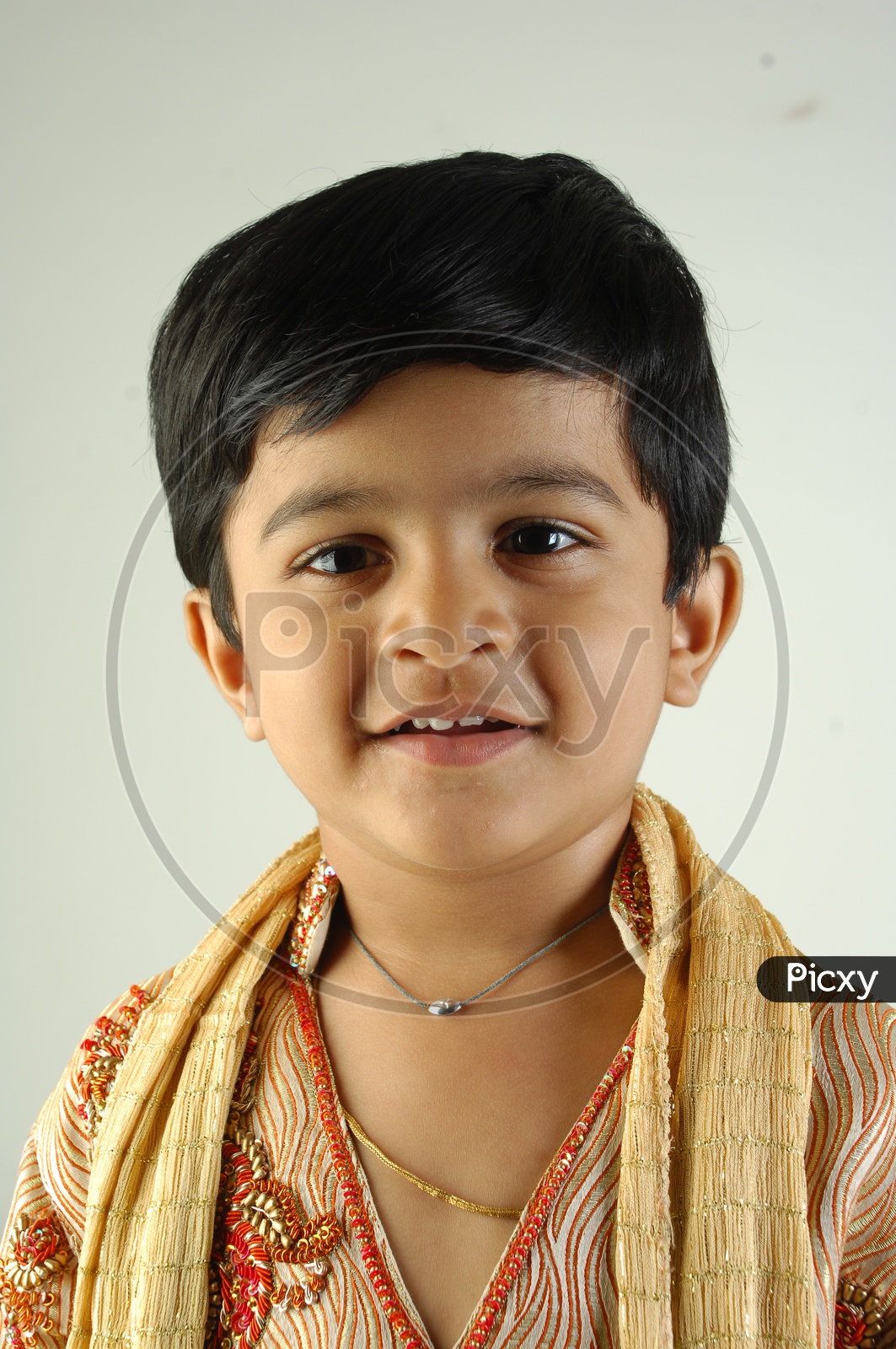 Indian Boy in Traditional Clothes With a Smiling Face   Over an Isolated White Background
