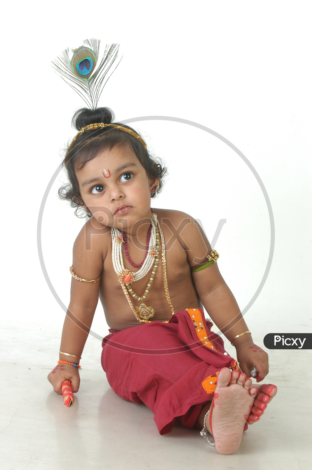 A Cute Indian Boy in a Hindu God Sri Krishna Getup