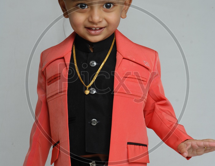 Indian Boy Child  Closeup Shot With a Smiling Face Over an Isolated White Background