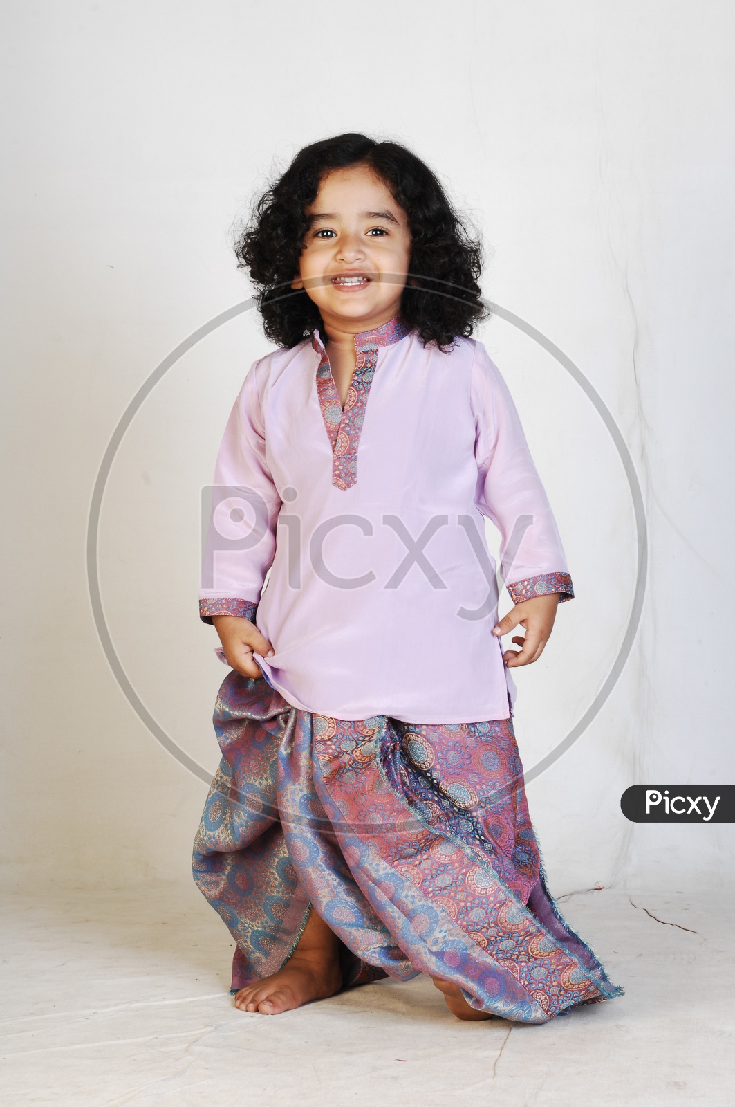 Indian Boy in Traditional Attire Over an Isolated White Background