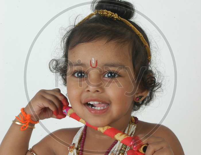 A Cute Indian Boy in a Hindu God Sri Krishna Getup