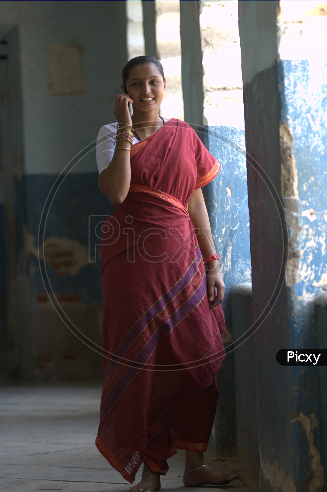 Indian Rural Woman Speaking In CellPhone