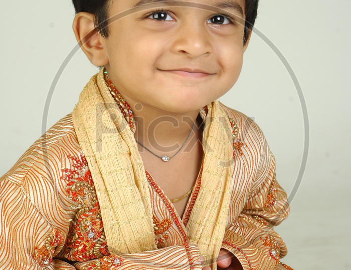 Indian Boy in Traditional Clothes With a Smiling Face Over an Isolated White Background
