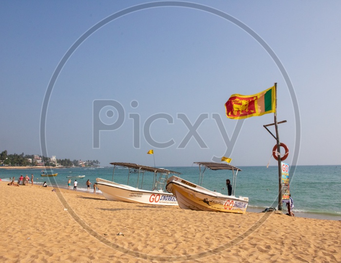Snorkeling boats at Unawatuna with Srilankan Flag