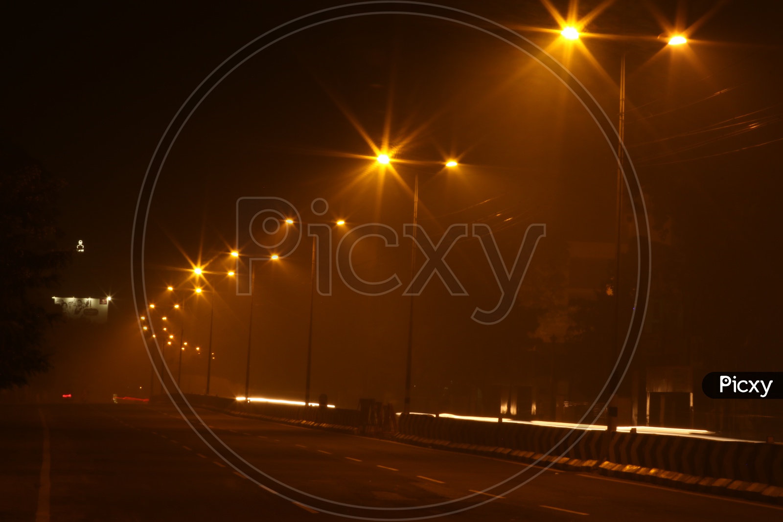 A Beautiful Long Exposure Shot Of a Highway Road With Lights In The Night Time and Vehicles Moving on the Road