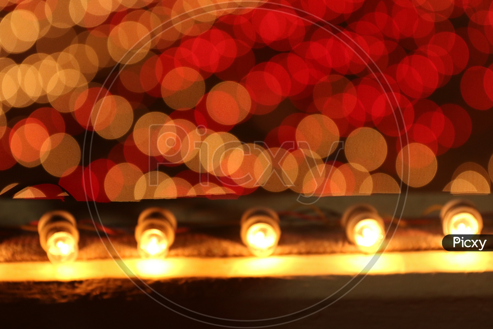 A Beautiful illusion effect Created By Bokeh Effect of Led diwali Dias  forming a Background