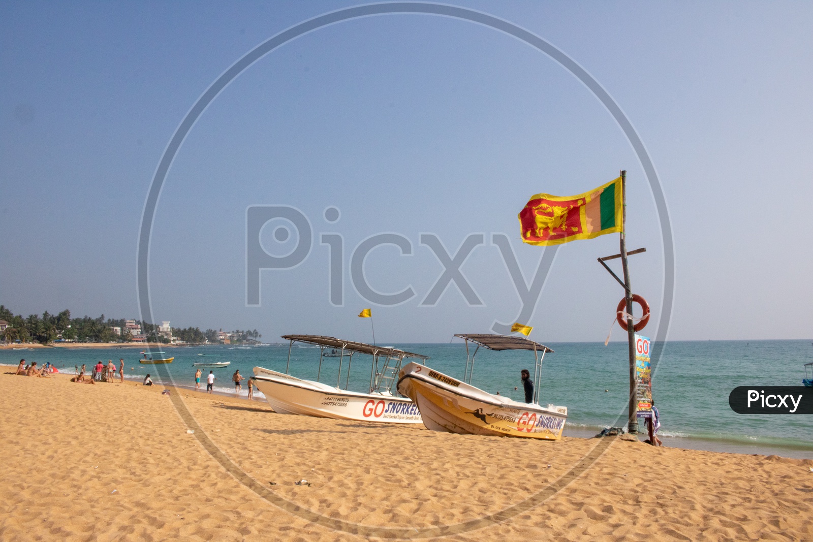 Snorkeling boats at Unawatuna with Srilankan Flag