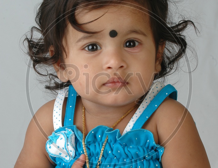 Adorable Indian Girl Child Closeup Shots With Cute expressions over an Isolated white Background