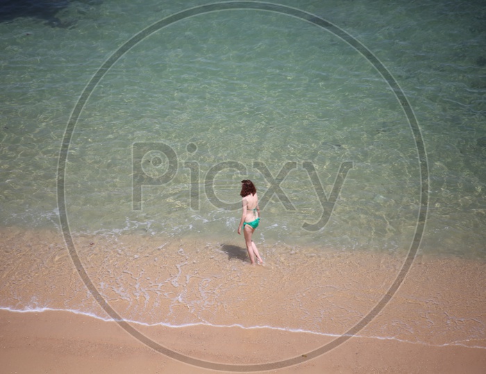 An Young Lady Playing in a Beach with Joy
