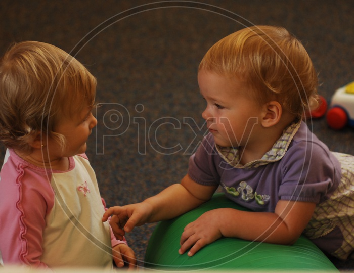 Children / Kids Playing With Toys and Smiling