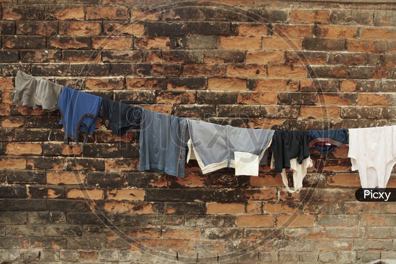 clothes on a string to dry under sun