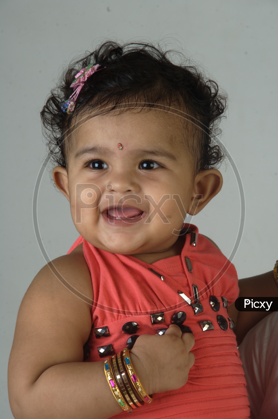 Indian Girl kid in a studio smiling