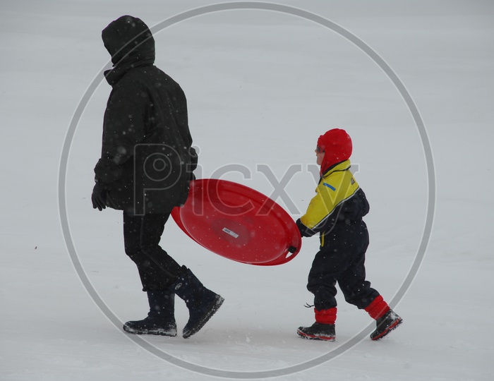 A Father And his Child in Snow