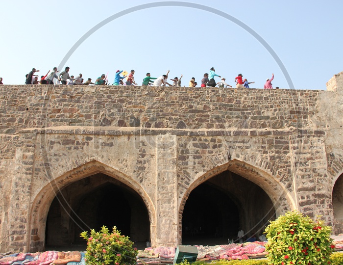 People Running On the roof top of Golconda