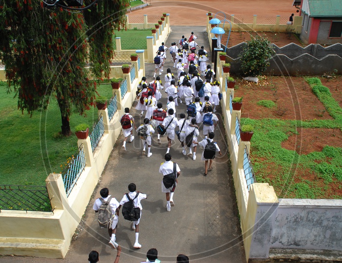 Aerial View of School Children Running From Classes After Class Hours